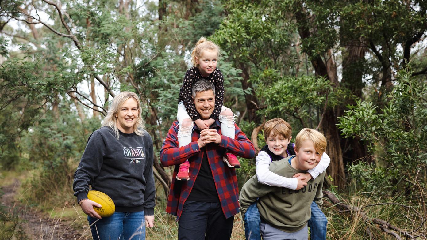 Family walk through bush trail, they are happy