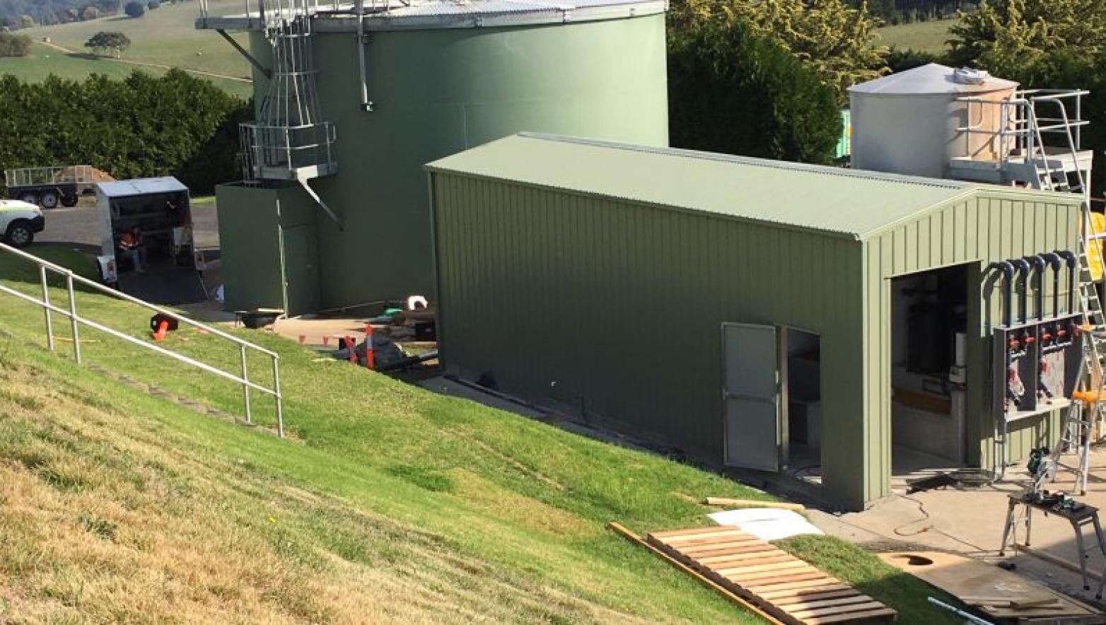 Green shed on grass